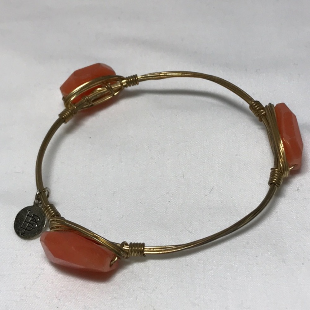 Bourbon and bow ties peach stone 8 in bangle bracelet, gold tone